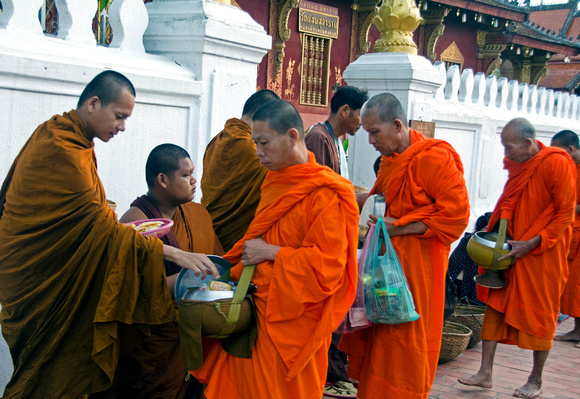 Monks collecting food Luang Prabang.a