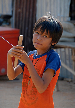 Burmese boy flying kite