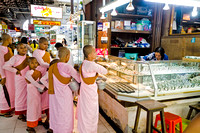 Female monks collecting alms in Bogyoke market