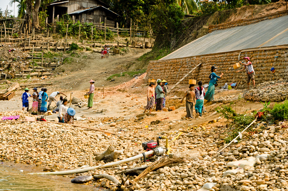 Workers on the riverbank