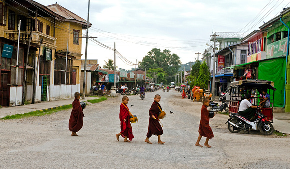 Young monks crossing the road