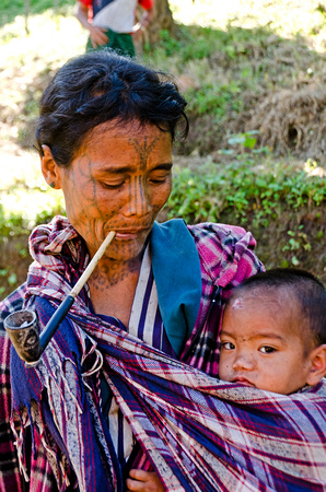 Chin mother with baby on the road outside Mindat