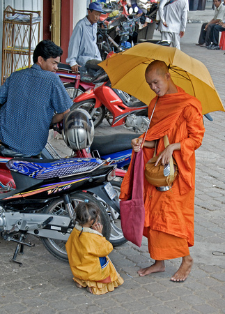Child making merit in Phnom Penh