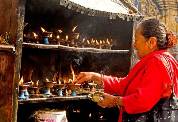 Lighting the butter lamps in Kathmandu, Nepal