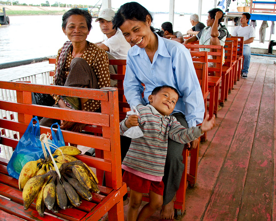 Happy family on ferry crossing the Tonle Sap