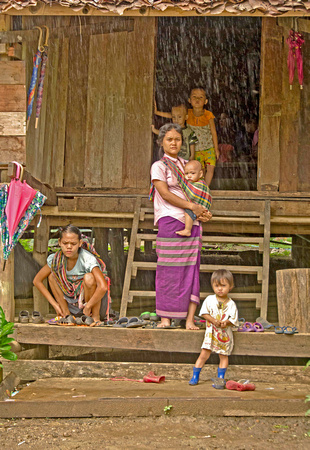 Posing in the rain in Burmese refugee camp, Mae La, Thailand