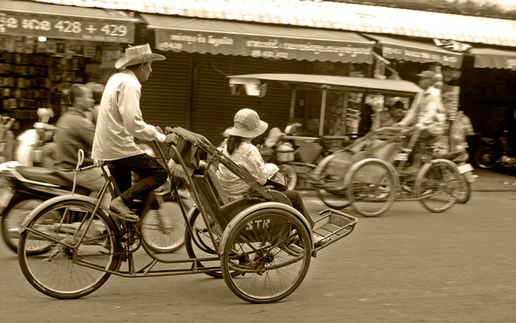 Rickshaw on the move Phnom Pehn