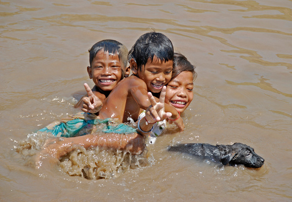 Kids in the Muddy Tonle Sap River