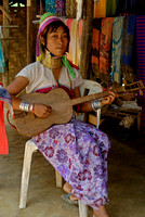 Kayan Girl playing Guitar