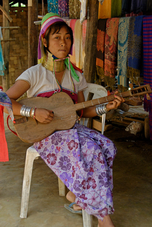 Kayan Girl playing Guitar