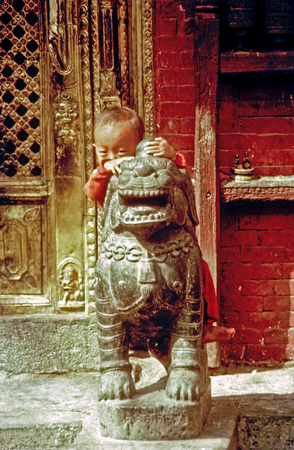 Kid with Chinese statue